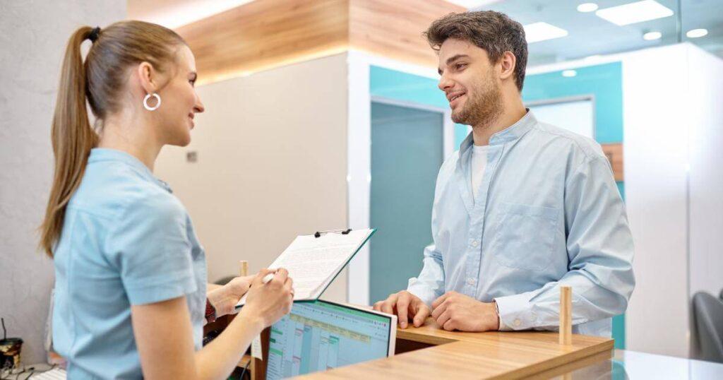 man making positive first impression with receptionist for interview