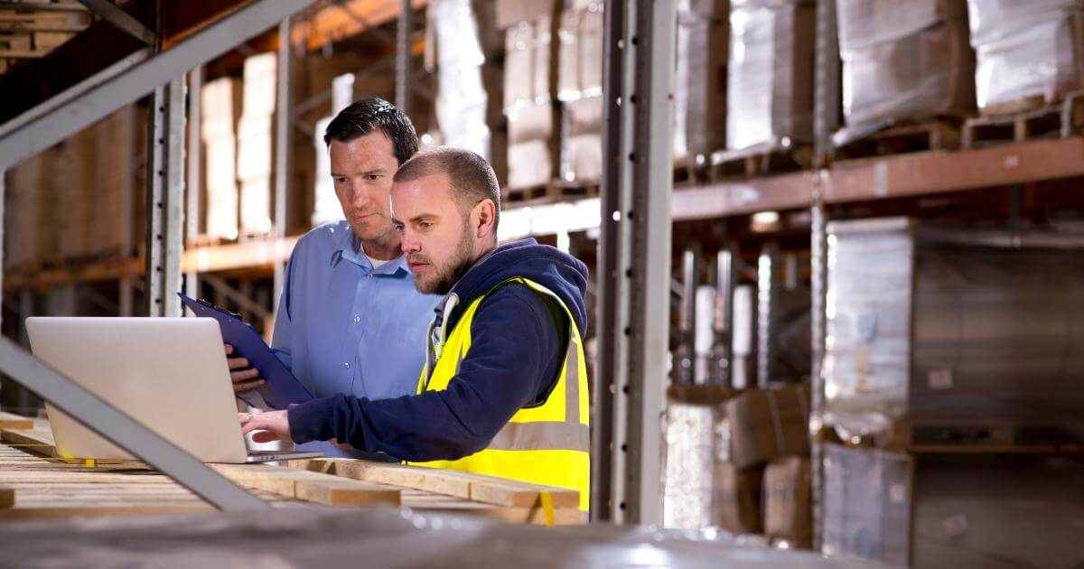 what you’re actually paying for cheap labor (1) warehouse managers looking at laptop