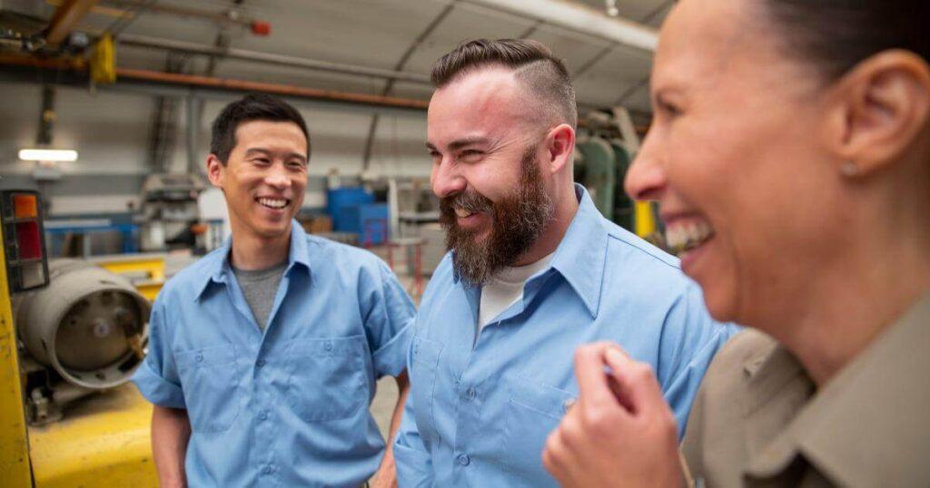 manufacturing teammates laughing with each other