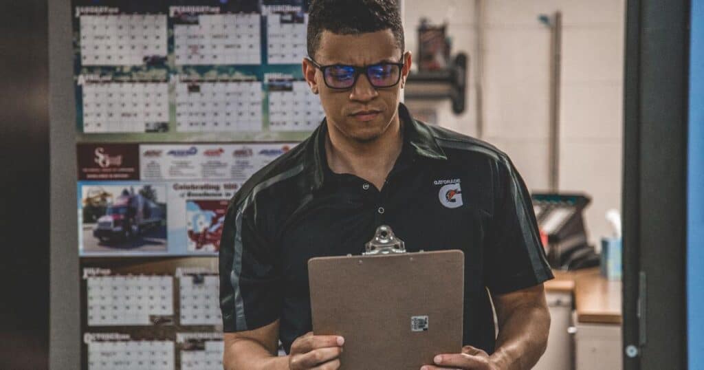 production manager reviewing employee attendance records