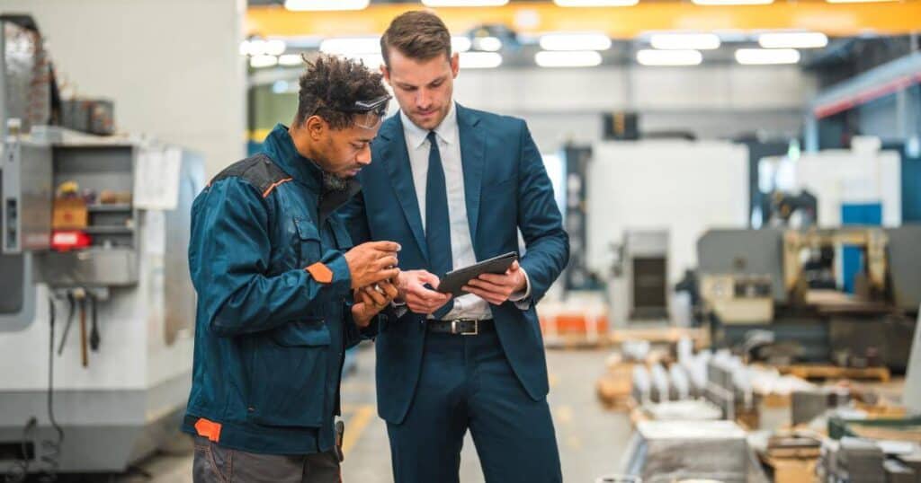 manufacturing worker collaborating with supervisor