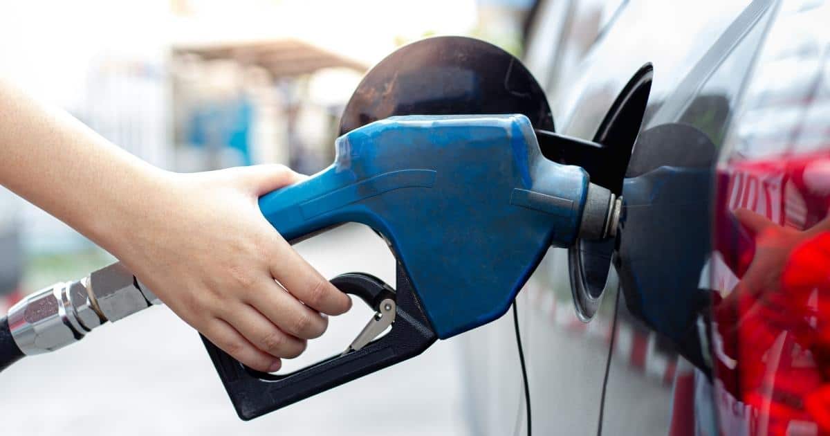 person pumping gas