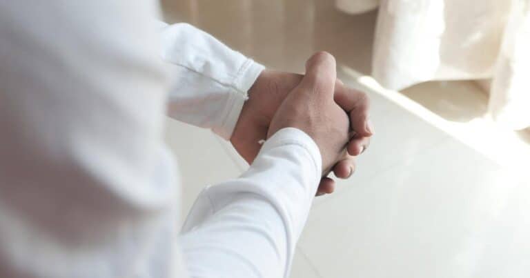 worried person wringing hands