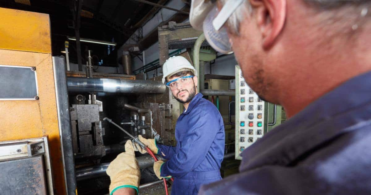 manufacturer worker with his mentor